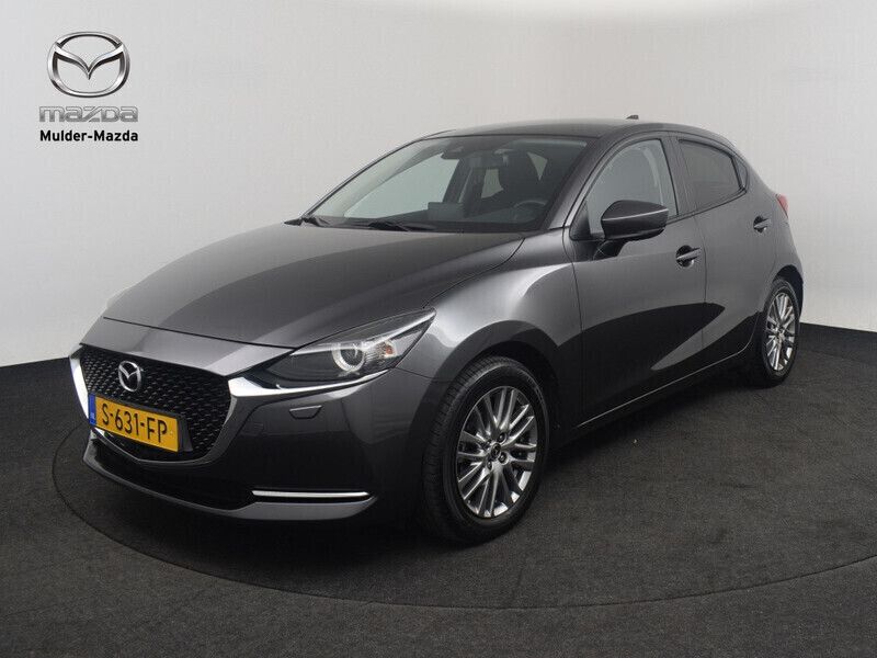 Machine gray (grijs metallic) Gebruikt 2023 Mazda 2 Luxury Hatchback | € 20.750 (Eerlijke prijs) - Afbeelding 1/4