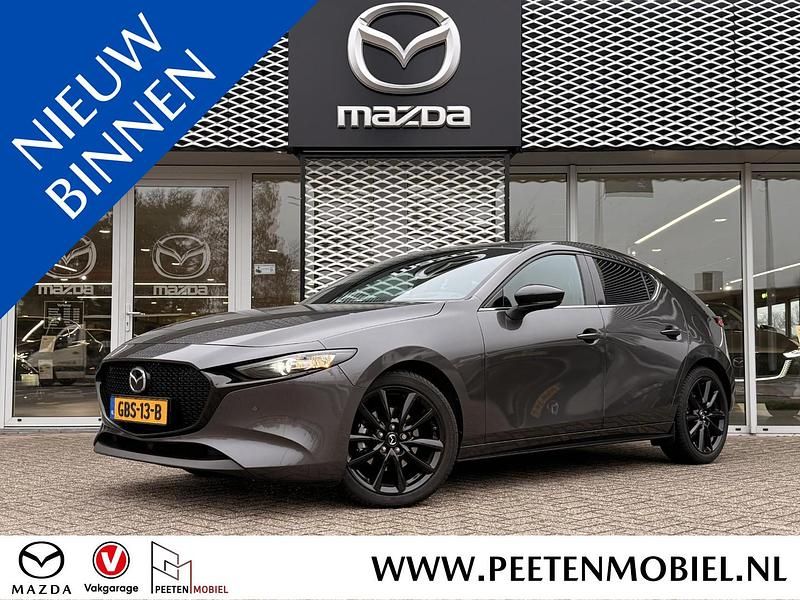 Machine grey Occasion 2024 Mazda 3 Nagisa Hatchback | € 27.895 (Eerlijke prijs) - Afbeelding 1/2