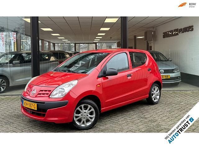 Rood (metallic) Gebruikt 2012 Nissan Pixo Hatchback | € 2.990 (Eerlijke prijs) - Afbeelding 1/4