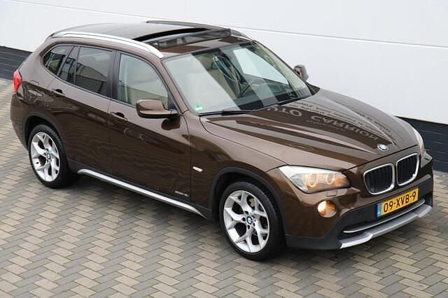 Bruin Gebruikt 2011 BMW X1 Executive SUV | € 6.745 (Goede deal) - Afbeelding 1/4