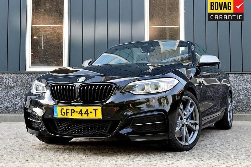 Zwart Gebruikt 2018 BMW M240 Executive Cabriolet | € 33.950 (Goede deal) - Afbeelding 1/4