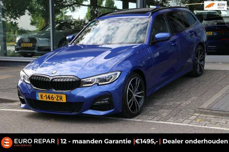 Blauw, metallic lak Gebruikt 2021 BMW 330e Executive Stationwagen | € 29.995 (Eerlijke prijs) - Afbeelding 1/4