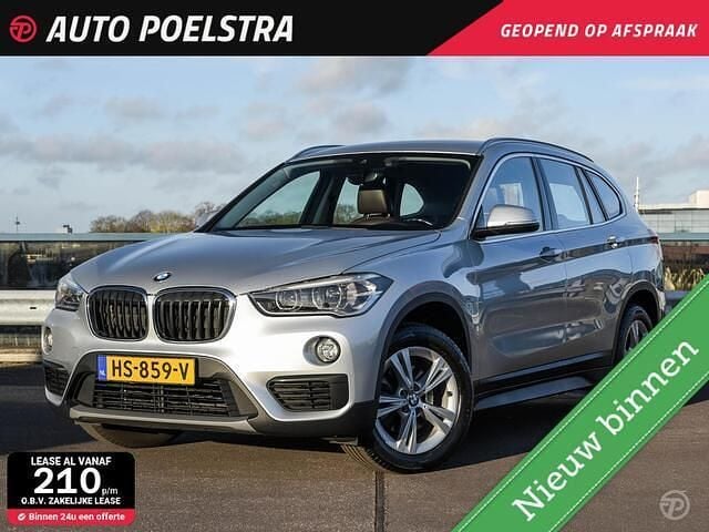 Grijs (metallic) Gebruikt 2015 BMW X1 Comfort Edition SUV | € 12.950 (Goede deal) - Afbeelding 1/4