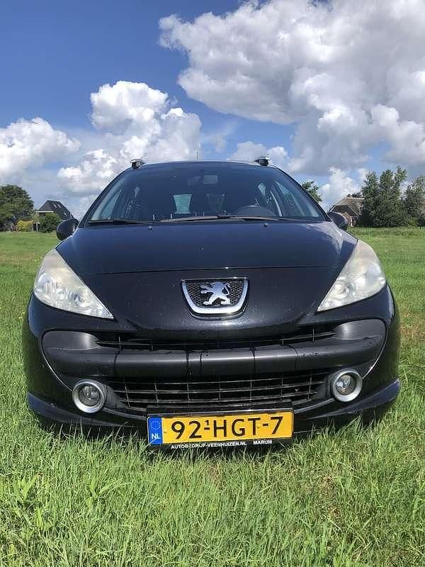 Zwart Gebruikt 2009 Peugeot 207 Stationwagen | € 875 (Goede deal) - Afbeelding 1/4