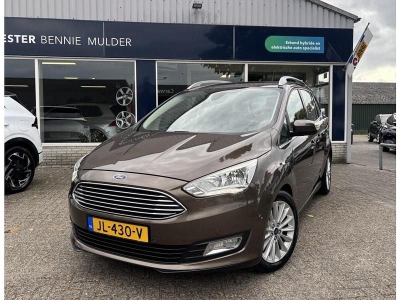 Bruin, metallic lak Gebruikt 2016 Ford Grand C-Max Titanium MPV | € 12.450 (Iets duurder) - Afbeelding 1/4