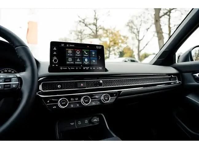 Nieuw Honda Civic Hybrid 143 PK (105 kW) 2025 Blauw (metallic) Hatchback