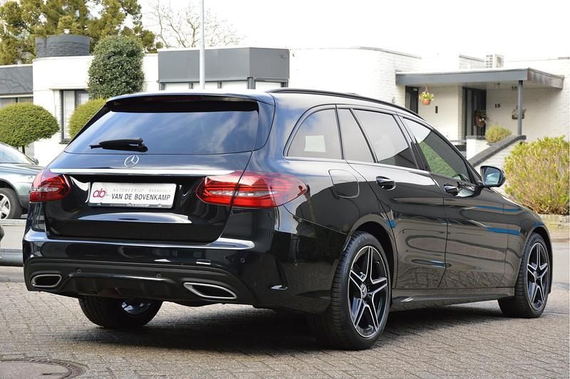 Occasion Mercedes C180 AMG line 157 PK (115 kW) 2021 Zwart Stationwagen