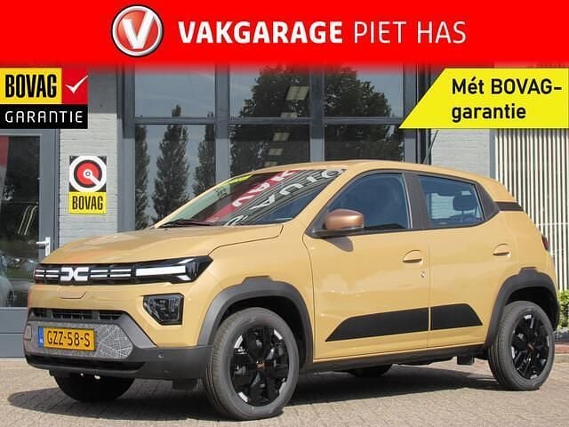 Bruin Nieuw 2025 Dacia Spring Extreme Hatchback | € 17.900 - Afbeelding 1/4