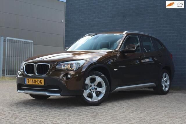 Bruin Gebruikt 2011 BMW X1 Executive SUV | € 10.950 (Goede deal) - Afbeelding 1/4