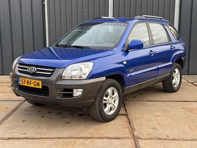 Blauw (metallic) Gebruikt 2005 Kia Sportage SUV | € 4.450 (Eerlijke prijs) - Afbeelding 1/4
