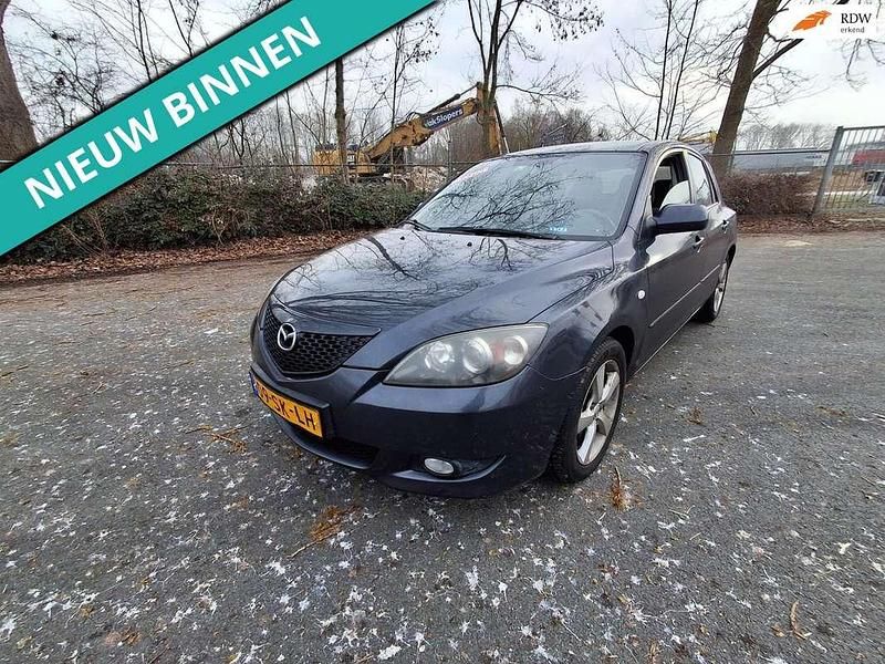 Grijs (metallic) Occasion 2006 Mazda 3 Inclusive Hatchback | € 999 (Goede deal) - Afbeelding 1/4