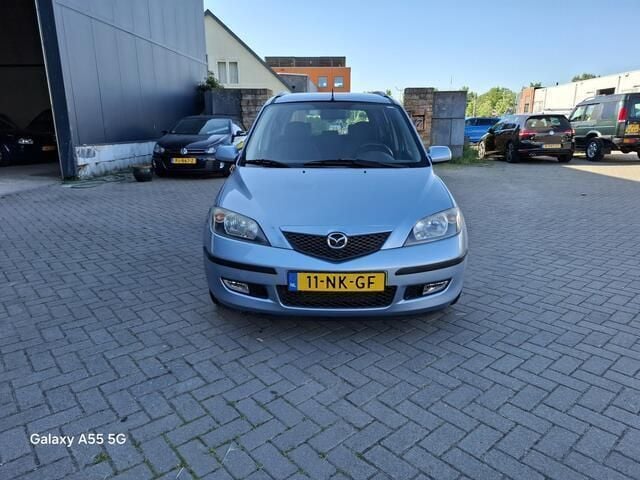 Blauw Gebruikt 2003 Mazda 2 Touring MPV | € 1.550 (Eerlijke prijs) - Afbeelding 1/4