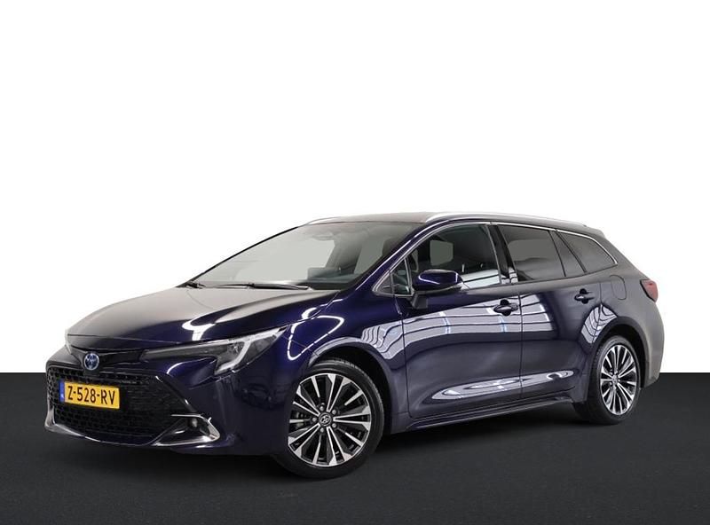 Blauw Gebruikt 2024 Toyota Corolla Hybrid Stationwagen | € 28.950 - Afbeelding 1/4
