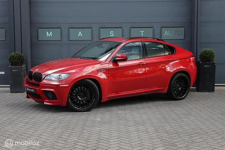 Rood (metallic) Occasion 2010 BMW X6 M Comfort Edition SUV | € 26.740 - Afbeelding 1/4