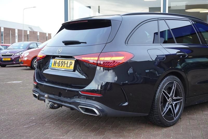Occasion Mercedes C200 AMG line 204 PK (150 kW) 2021 Zwart Stationwagen