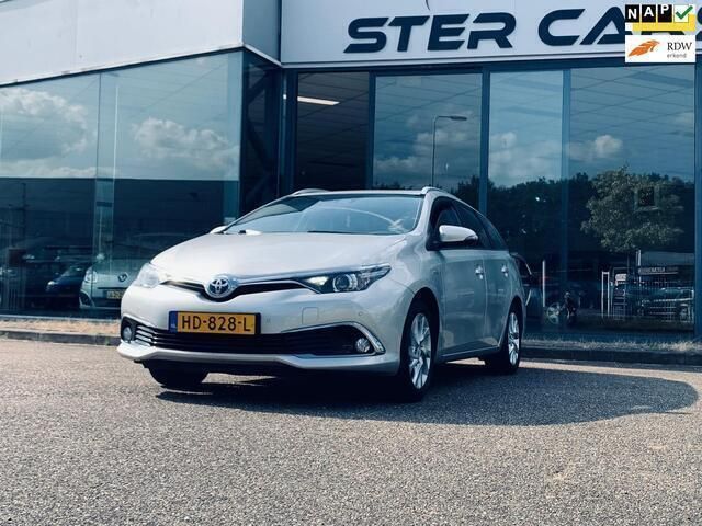 Grijs, metallic lak Gebruikt 2015 Toyota Auris Touring Sports Executive Stationwagen | € 13.900 (Eerlijke prijs) - Afbeelding 1/4