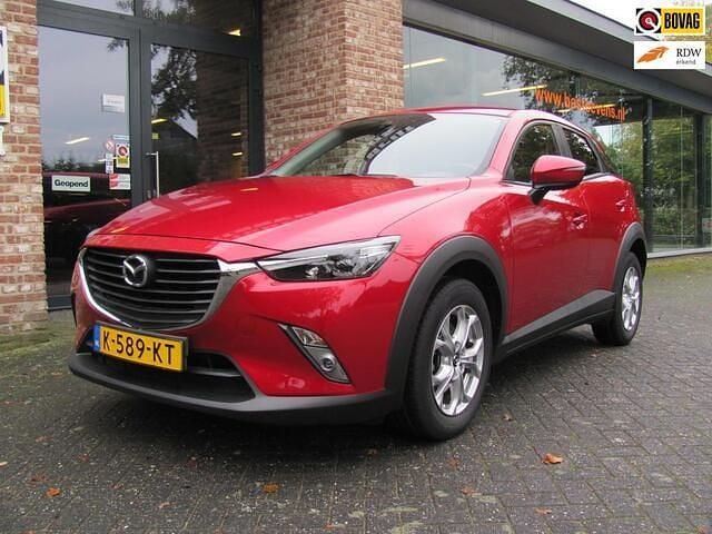Rood (metallic) Gebruikt 2015 Mazda CX-3 SUV | € 14.950 (Eerlijke prijs) - Afbeelding 1/4