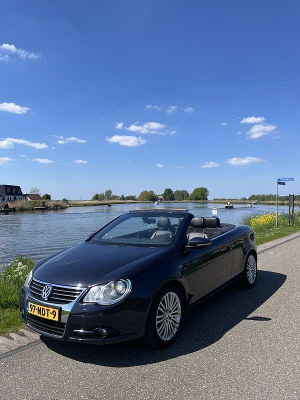 Blauw Gebruikt 2010 VW Eos Highline Cabriolet | € 7.250 (Eerlijke prijs) - Afbeelding 1/4