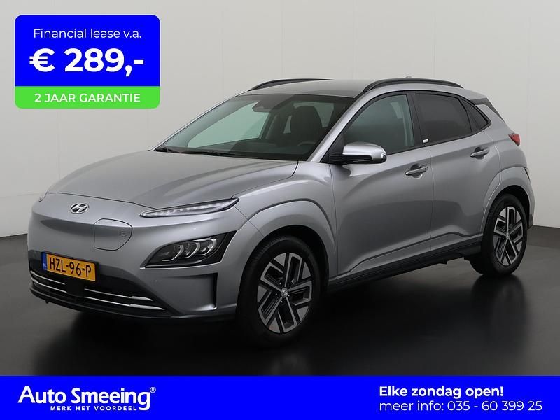 Shimmering silver metallic (r2t) Gebruikt 2021 Hyundai Kona SUV | € 21.945 (Eerlijke prijs) - Afbeelding 1/4