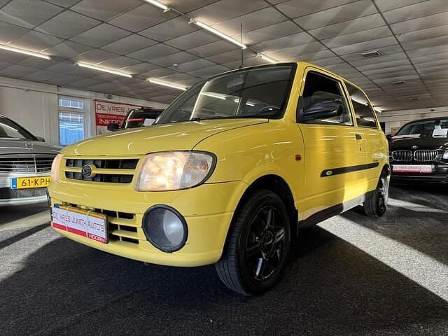 Geel Occasion 2001 Daihatsu Cuore Hatchback | € 999 (Iets duurder) - Afbeelding 1/4