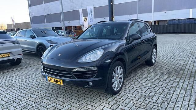 Zwart (metallic) Occasion 2012 Porsche Cayenne SUV | € 20.999 - Afbeelding 1/4