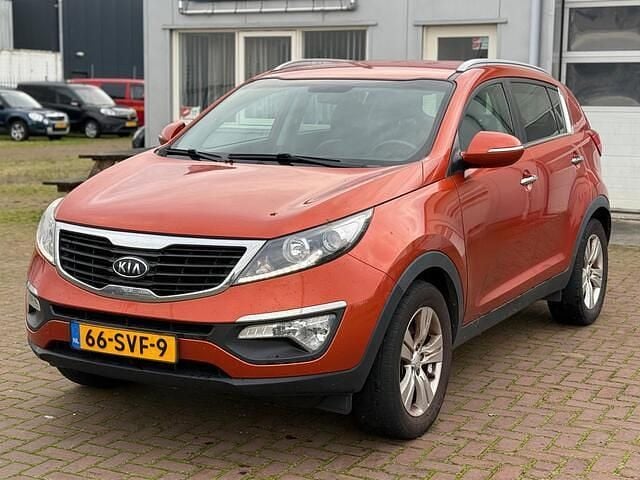 Oranje (metallic) Gebruikt 2012 Kia Sportage Plus SUV | € 6.400 (Eerlijke prijs) - Afbeelding 1/4