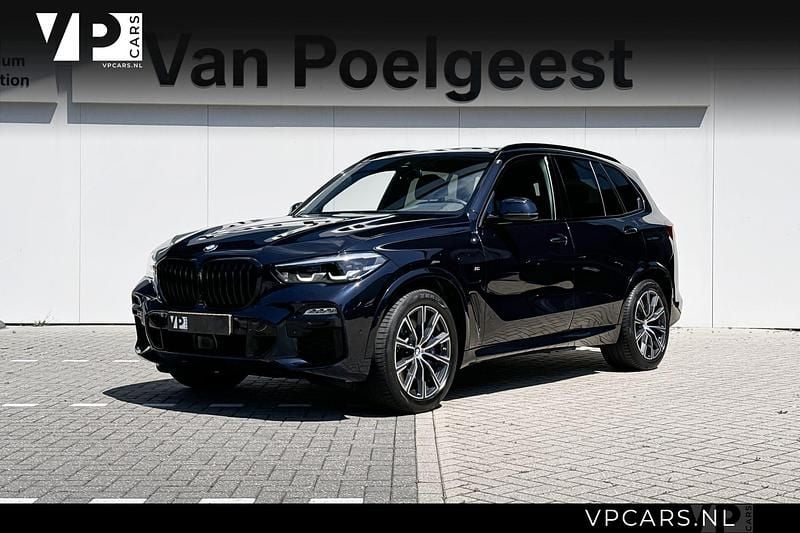 M carbonschwarz Gebruikt 2021 BMW X5 Executive SUV | € 49.900 (Super prijs) - Afbeelding 1/4