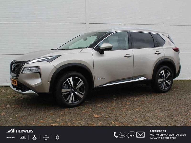 Champagne silver (licht grijs) Gebruikt 2023 Nissan X-Trail Tekna SUV | € 38.935 (Eerlijke prijs) - Afbeelding 1/4