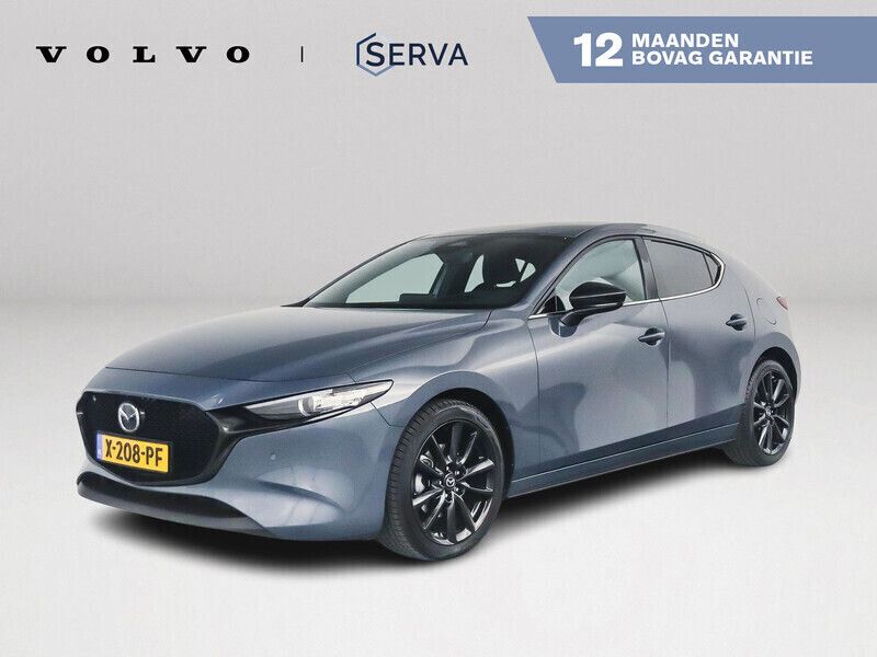 Grijs, metallic lak Gebruikt 2024 Mazda 3 Homura-Line Hatchback | € 28.995 (Eerlijke prijs) - Afbeelding 1/4