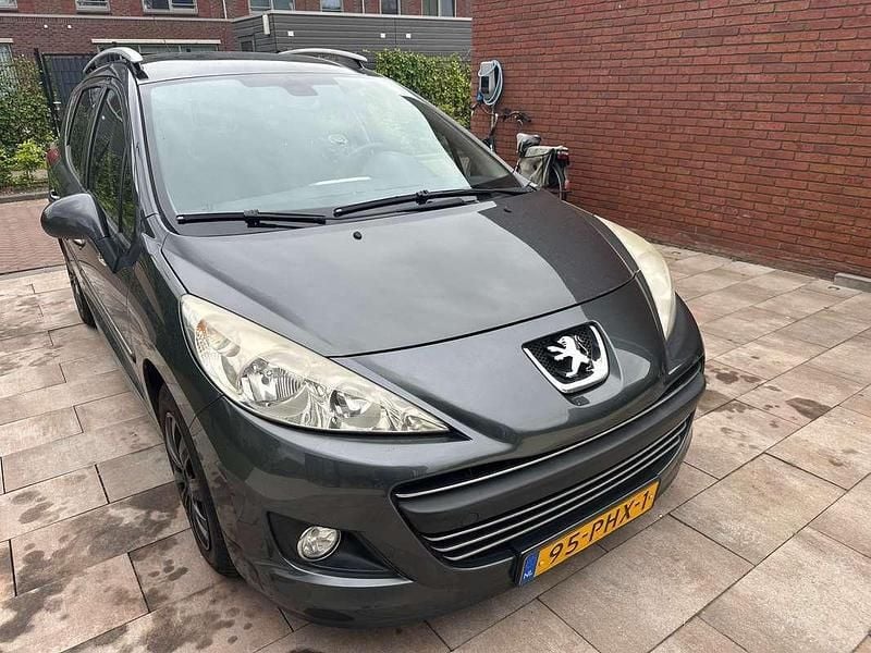Grijs Gebruikt 2011 Peugeot 207 Stationwagen | € 1.499 (Goede deal) - Afbeelding 1/4