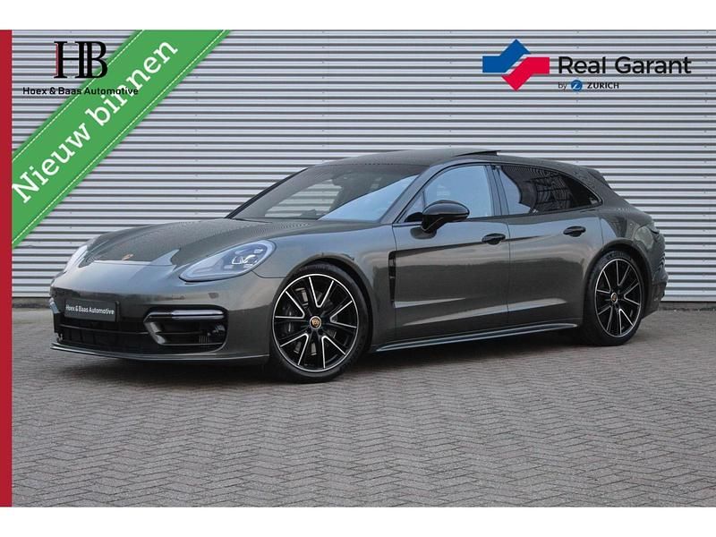 Groen Occasion 2023 Porsche Panamera Platinum Edition Stationwagen | € 94.940 (Eerlijke prijs) - Afbeelding 1/4