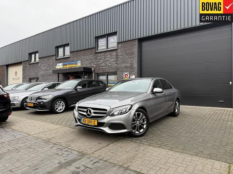 Grijs Gebruikt 2015 Mercedes C180 Prestige Sedan | € 17.950 (Goede deal) - Afbeelding 1/4