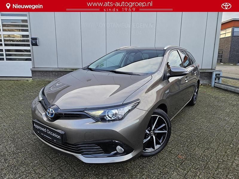 Bruin Occasion 2019 Toyota Auris Hybrid Plus Stationwagen | € 17.750 (Eerlijke prijs) - Afbeelding 1/4