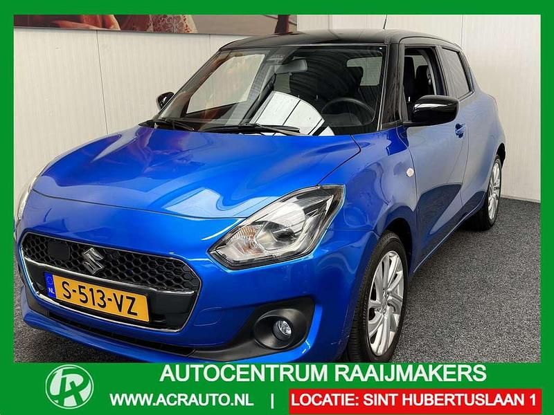 Blauw, metallic lak Gebruikt 2020 Suzuki Swift Hatchback | € 17.935 (Goede deal) - Afbeelding 1/4