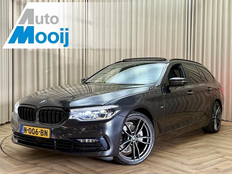 Grijs Gebruikt 2018 BMW 520 Sport Line Stationwagen | € 19.950 (Goede deal) - Afbeelding 1/4
