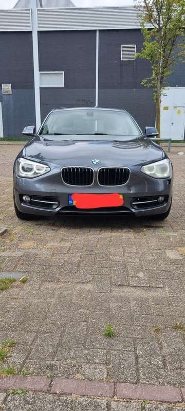 Grijs Gebruikt 2013 BMW 120 Sport Line Hatchback | € 5.100 (Super prijs) - Afbeelding 1/4