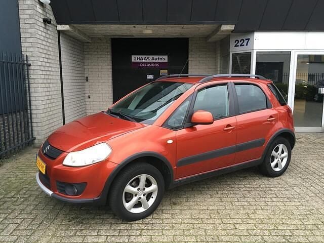Oranje Gebruikt 2006 Suzuki SX4 Exclusive MPV | € 3.399 (Goede deal) - Afbeelding 1/4