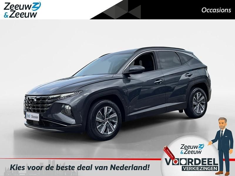 Dark knight pearl (yg7) Gebruikt 2021 Hyundai Tucson Comfort SUV | € 25.950 (Goede deal) - Afbeelding 1/3