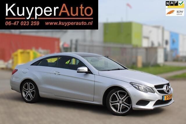 Grijs, metallic lak Gebruikt 2014 Mercedes E200 Prestige Coupé | € 15.750 (Eerlijke prijs) - Afbeelding 1/4
