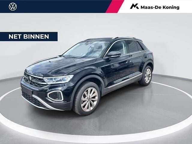 Zwart Gebruikt 2024 VW T-Roc Style SUV | € 33.440 (Eerlijke prijs) - Afbeelding 1/4