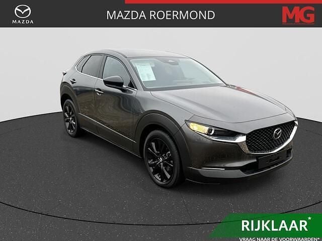 Machine gray metallic (46g) Occasion 2025 Mazda CX-30 Homura-Line SUV | € 32.445 (Goede deal) - Afbeelding 1/4