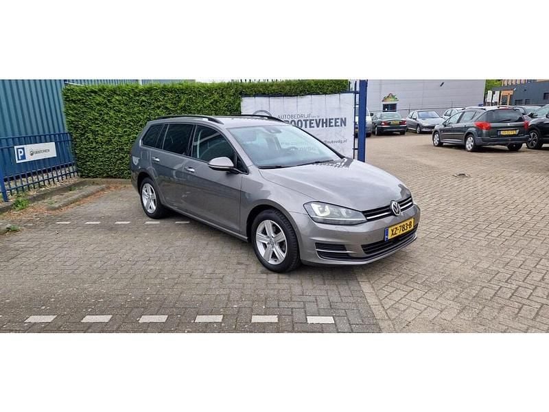 Grijs Gebruikt 2014 VW Golf VII Highline Stationwagen | € 13.995 (Eerlijke prijs) - Afbeelding 1/4