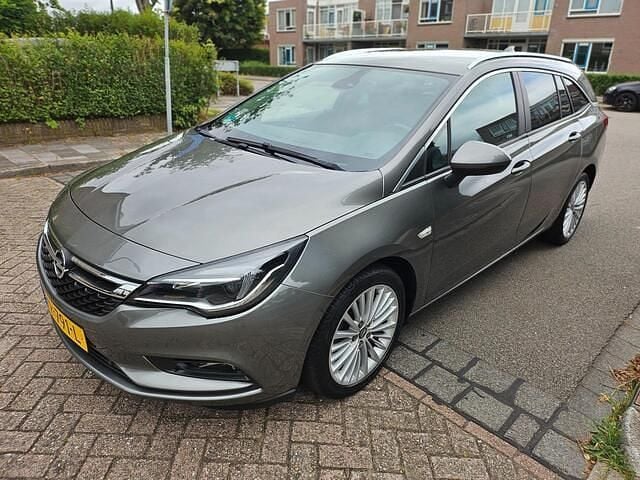 Grijs Gebruikt 2019 Opel Astra Edition Stationwagen | € 9.950 (Goede deal) - Afbeelding 1/4