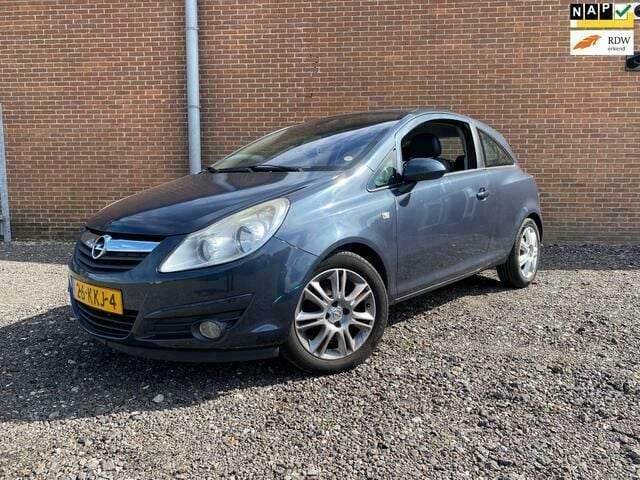 Grijs Gebruikt 2009 Opel Corsa Cosmo Hatchback | € 1.999 (Goede deal) - Afbeelding 1/4