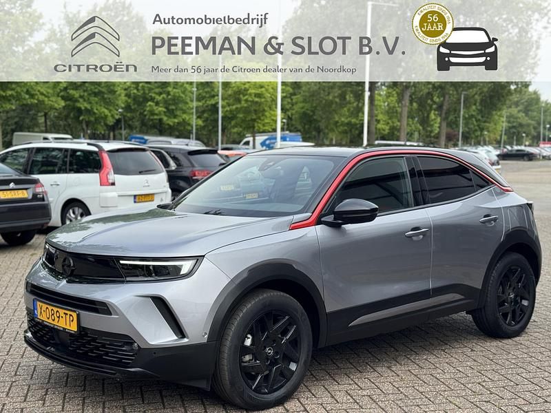 Grijs Gebruikt 2024 Opel Mokka-e SUV | € 22.745 (Eerlijke prijs) - Afbeelding 1/4