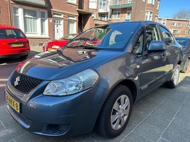Grijs Gebruikt 2009 Suzuki SX4 Comfort Sedan | € 3.750 (Super prijs) - Afbeelding 1/4