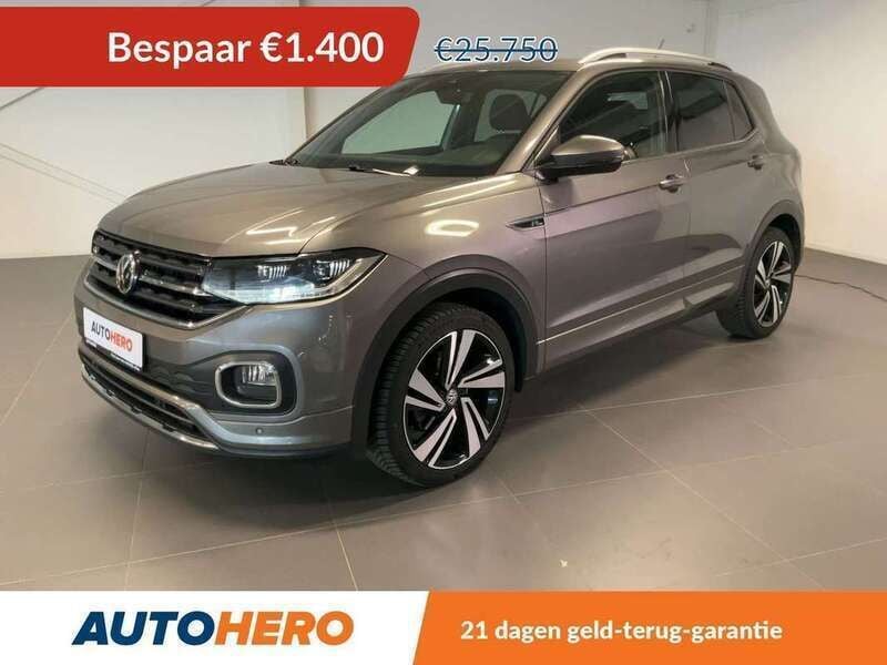 Grijs, metallic lak Gebruikt 2020 VW T-Cross R-line SUV | € 24.549 (Eerlijke prijs) - Afbeelding 1/3