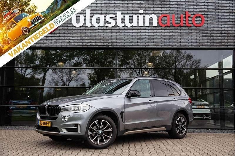 Grijs, metallic lak Gebruikt 2014 BMW X5 Executive SUV | € 19.950 (Goede deal) - Afbeelding 1/4