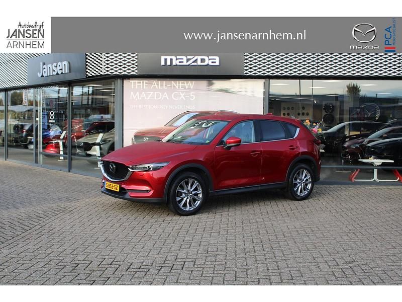 Soul red crystal metallic (46v) Occasion 2019 Mazda CX-5 Luxury SUV | € 27.900 (Eerlijke prijs) - Afbeelding 1/4