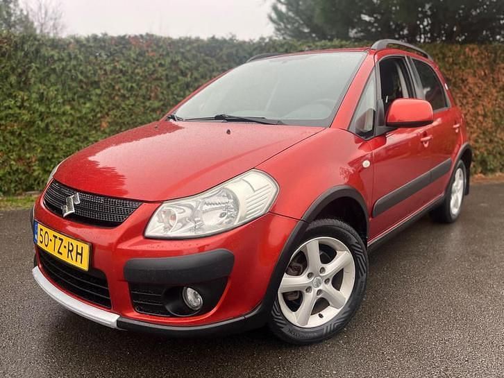 Oranje (metallic) Gebruikt 2007 Suzuki SX4 Exclusive MPV | € 1.488 (Eerlijke prijs) - Afbeelding 1/4